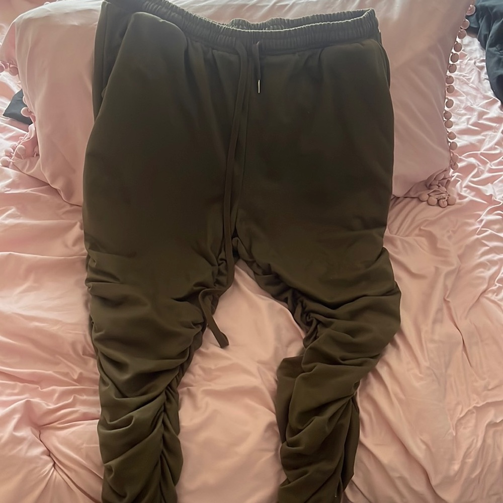 Stacked green sweats